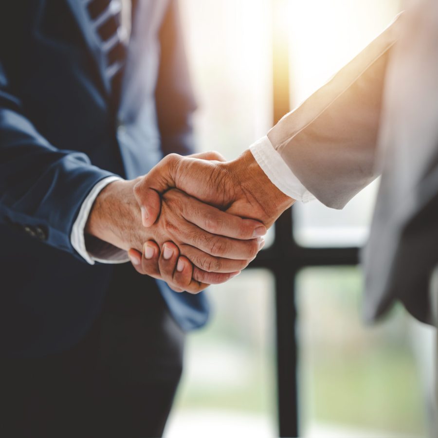 business partner handshake concept Colleagues shaking hands Successful deal after a great meeting. Blurred background.